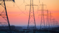 Electricity pylons at daybreak, Derbyshire/Nottinghamshire border, England, United Kingdom, Europe